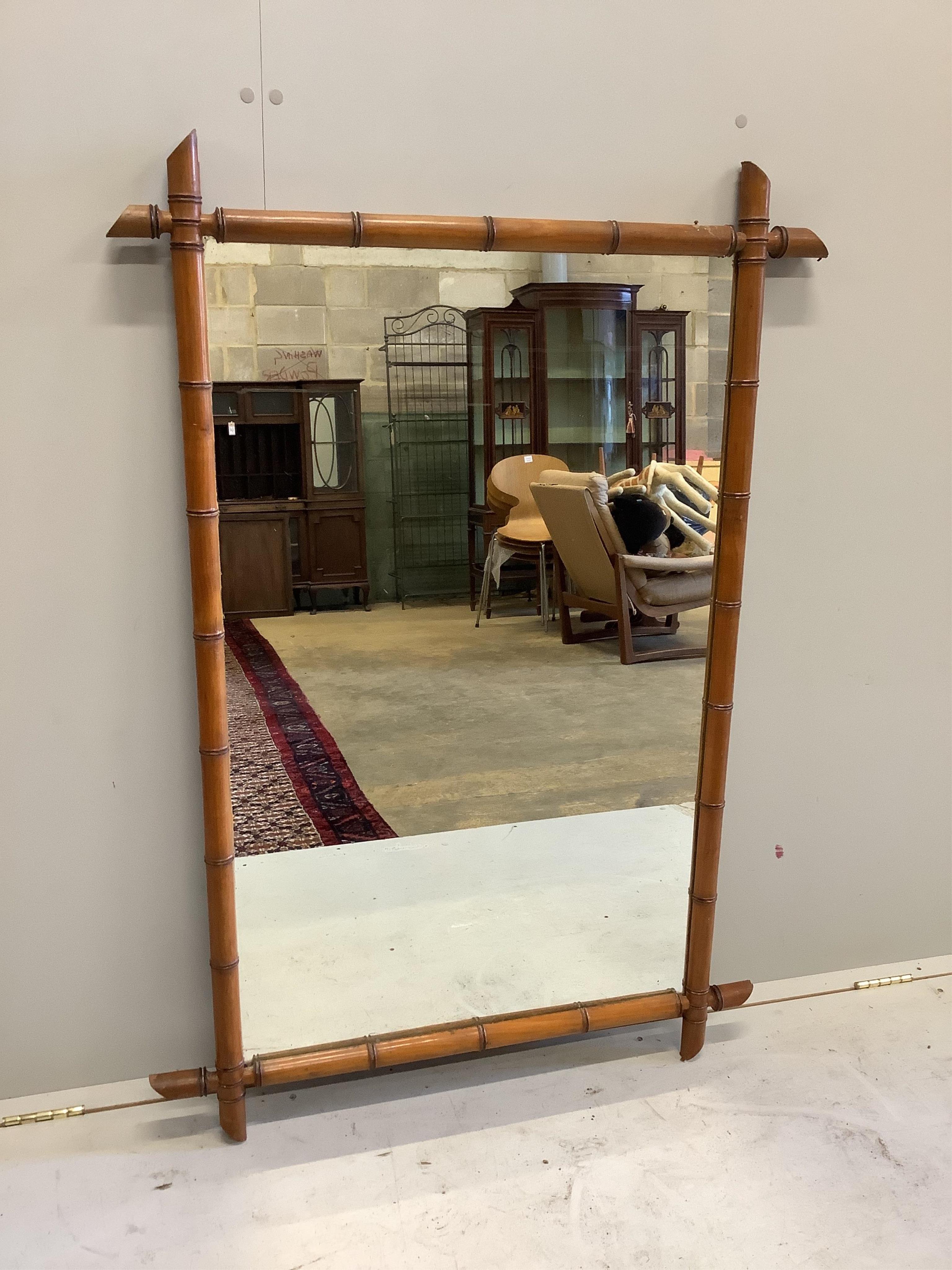 A late 19th century French simulated bamboo wall mirror, width 89cm, height 128cm. Condition - fair to good condition